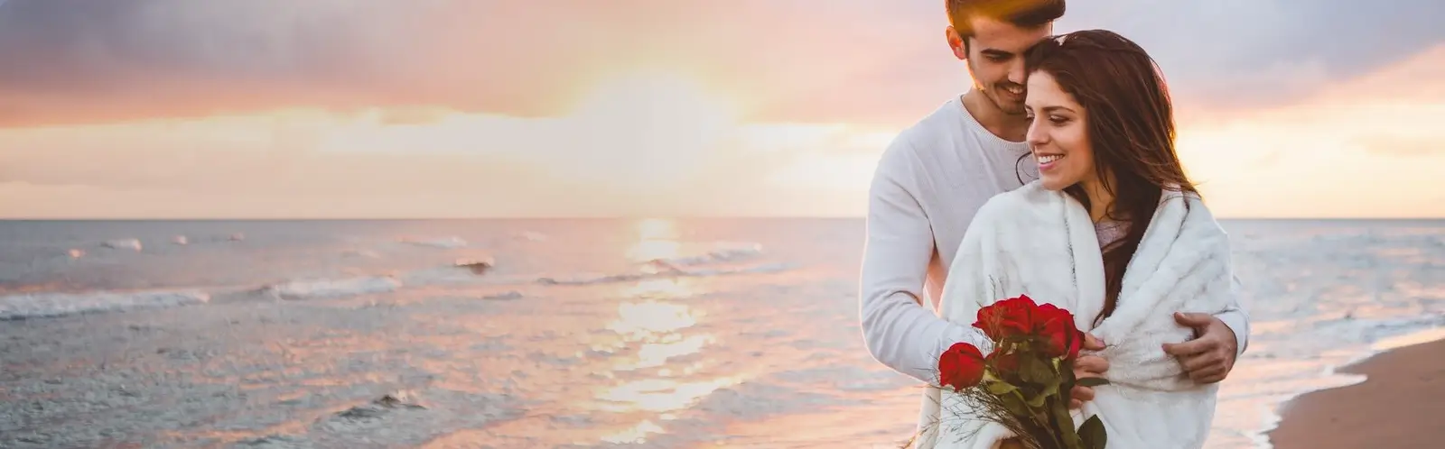 Honeymoon Couple enjoy the sandy beaches of Kerala